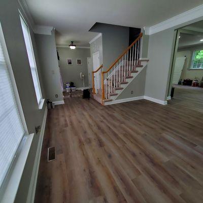 Removed old flooring and installed new luxury vinyl plank flooring throughout the entire first floor.