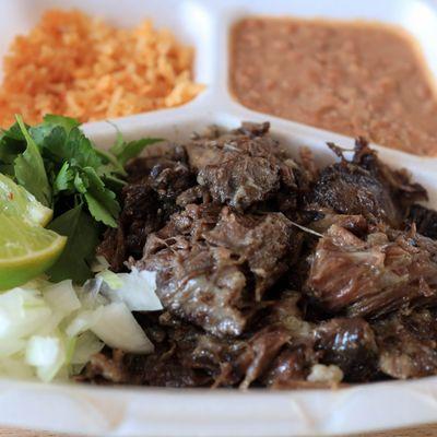 Barbacoa plate, with rice, beans, and tortillas.