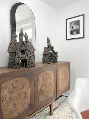 Swedish credenza, ceramic sculptures by John Brickels, Arch Mirror by Bower Studio, signed B&W photograph of Bob Dylan by Danny Clinch.