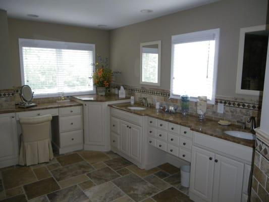 Solid painted maple custom Plain & Fancy cabinetry with granite top.  Vanity features his and her sinks, make up application ...