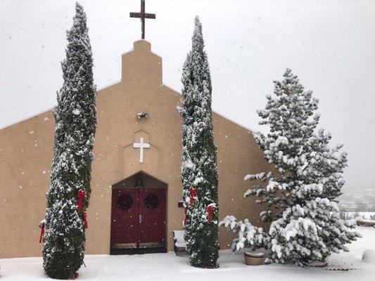 A beautiful church with snow.