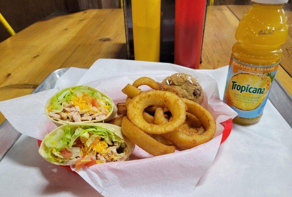 Chicken wrap with a side  of onion rings and a cookie!