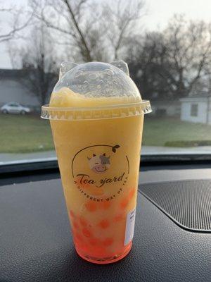 Mango smoothie with strawberry pop bobba