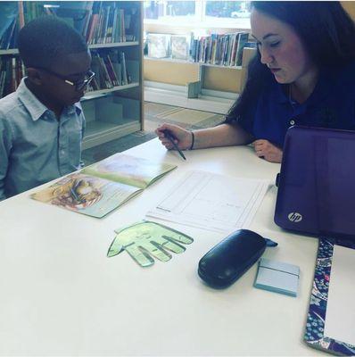 One of our fabulous tutors working with one of our amazing scholars