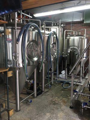 Ran steam, drain and water pipes from the boiler room to the brewery tanks