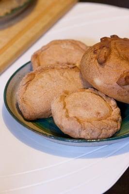 pineapple, sweet cheese, and coconut empanadas (with a roll on the right)