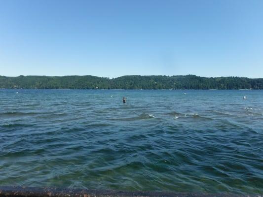 Beautiful view of a lone angler wading out from the stairs