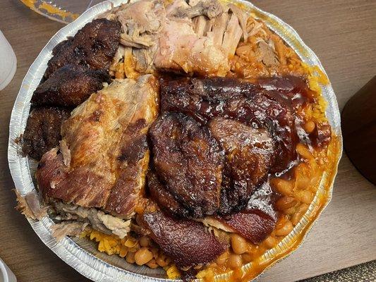 Plantains, pork, yellow rice, beans