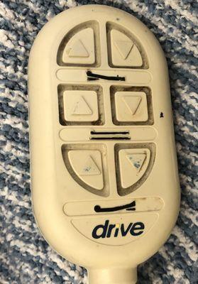 Grimy, dirty bed remote. Zoom in