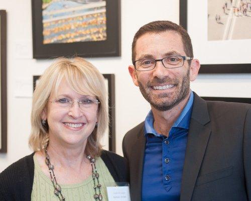 Renowned photography teacher David Coleman at an opening with Barbara Masek of the Peninsula Camera Club