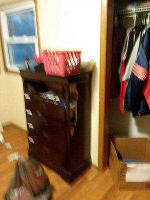 Broken dresser with mixed hygiene in baskets on top