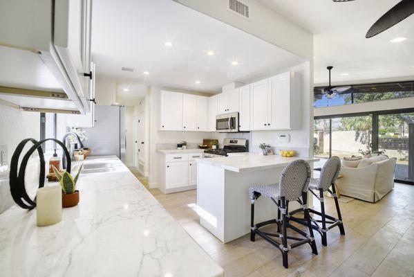 White kitchen cabinets and quartz countertops