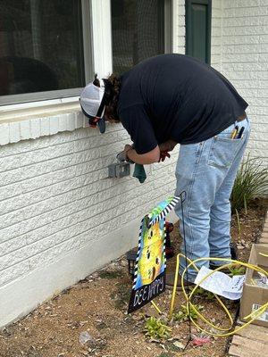 Here is one of the Amos Electric employees adding out outside outlet for us.