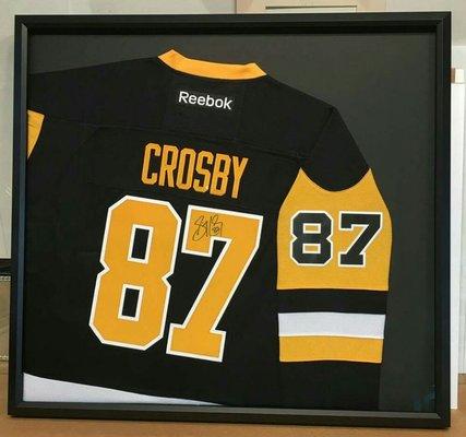 We have framed over 1000 jerseys, usually painstakingly symmetrical, this client wanted something different. We love the result!