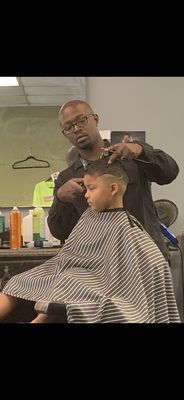 Owner of the barbershop getting my son right!