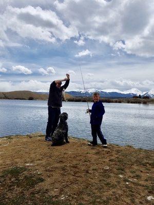 Dr Shane fishing with son Maddox and dog Bella