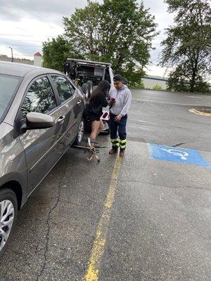 That's the tow truck driver and me trying to explain that I was pretty sure it's ILLEGAL to tow while someone's in their running car.