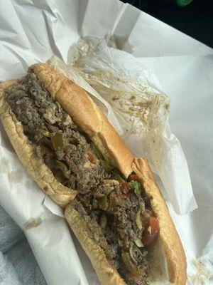 Mushroom Philly with hot & sweet peppers, fried onions, lettuce, tomatoes, salt/pepper