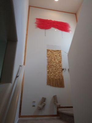 Featherzsh designing an "ARIES" fire fancy lifestyle on a high rise two-story interior home accent Wall!!