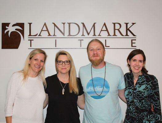 Marika C. Sevin, ESQ. (far left) and Sandra M Ralston, ESQ. (far right) smiling with happy customers after another smooth closing!