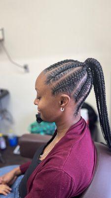 Large stitch braids in a ponytail