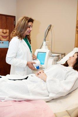 Dr. Chaudhary treating a coolsculpting patient.