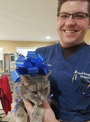 One of our Licensed Technicians with one of our clinic cats, Scorpi.