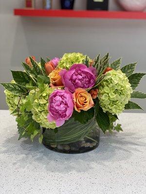 Seasonal spring centerpiece: roses, hydrangea, peonies