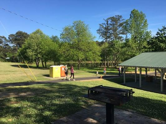 1.25 mile track around a small lake, tiny kids park with swings, slides, and various climbing equipment.