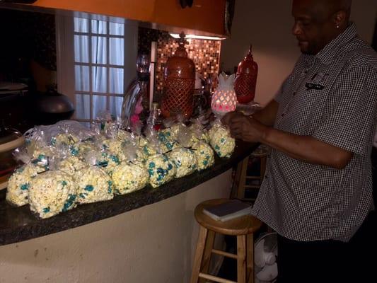 Jay preparing popcorn bags for the homeless.