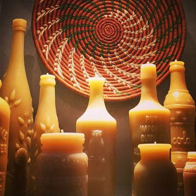 Fair Trade basket and beeswax candles made from antique bottle molds.