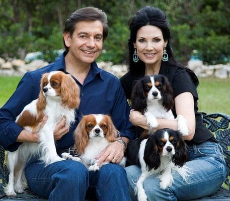 Orthodontist David Mireles and his wife, Lety, with four of their six Cavalier King Charles Spaniels