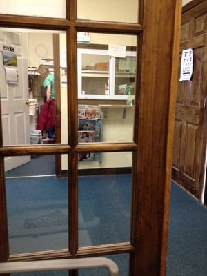 Entrance to mini office, gateway to exam rooms. There is a slightly larger waiting room outside these doors. It's a small place.