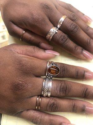 picture: purchased cross and plain band on my left ring finger and 3 layered ring with the spinning center on my right middle finger