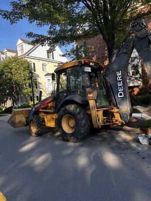 More machinery used to tear up sidewalks at 645 am