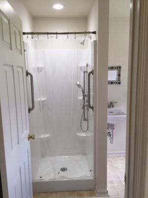 This is a shower and wall hung sink we installed for a customer in her laundry room. Permits were pulled and passed inspection.