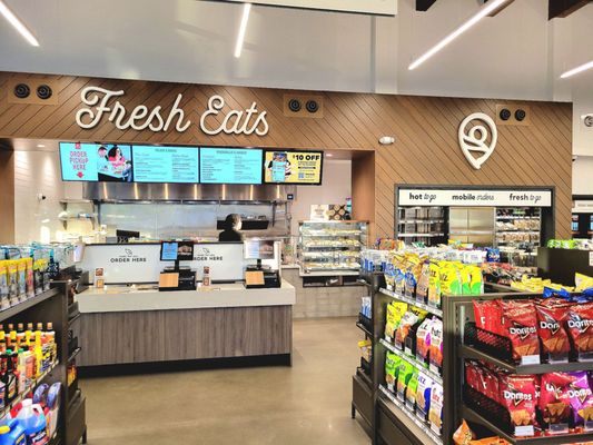 The order kiosks and kitchen. Ready-made food is on the far right.