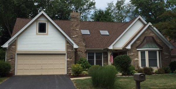 After - Added a large picture window to garage attic to let in more natural light and re-sided with LP SmartTrim.