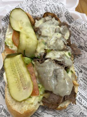 Philly cheese steak with cheese, mushrooms, peppers, onions and pickles, lettuce & tomato-