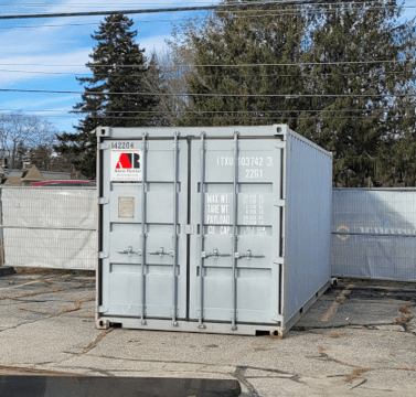 20′ storage container rental was delivered to a new car dealership for window storage at Brunswick, ME.