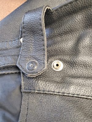 We alter motorcycle pants. We can place new snaps and shorten the hem.