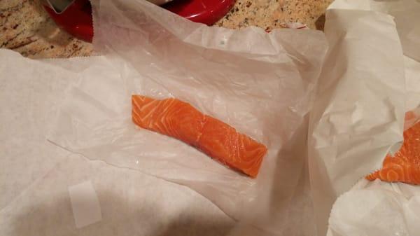 The employee's attempt at cutting a 1lb salmon filet in 'half'.  Total weight just over 0.2 lbs.