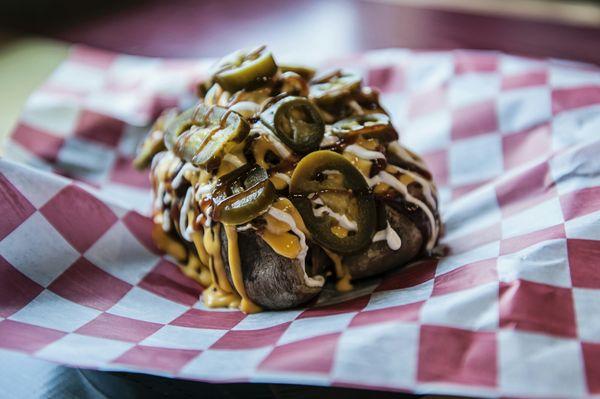 Monster Potato......a huge potato smothered in pulled pork, cheese, sour cream, bbq sauce and jalapenos!