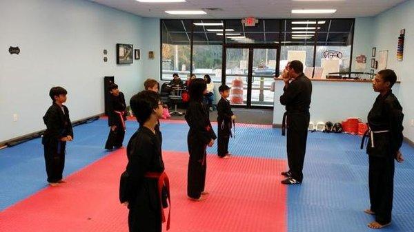 Self defense classes are group settings, where students can train with their peers.