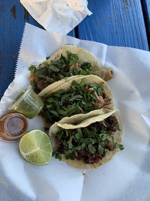 tacos de carnitas and tripa and cabeza