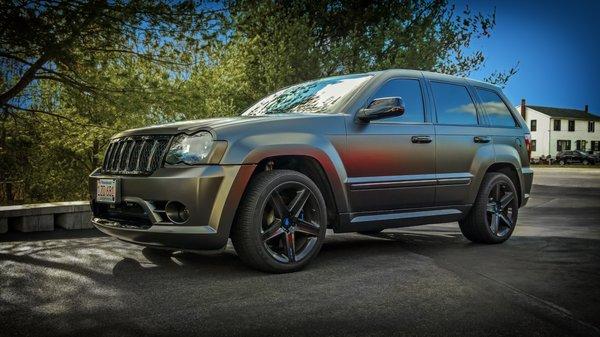 Our Jeep Grand Cherokee SRT with our Gold Package Window Tint and Avery Satin Pearl Nero Vinyl Wrap