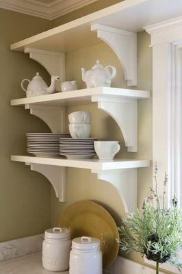 Floating shelves with traditional corbels add an airy decorative look to a kitchen.  You do need to keep them tidy!