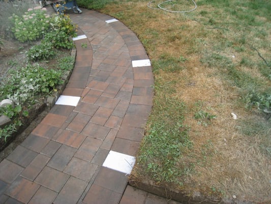 Paver side walk with lights.