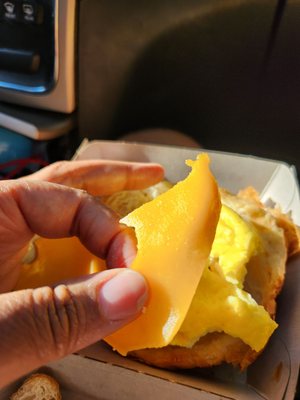 Grabbed two breakfast sandwiches this morning since we were in the neighborhood. These were ATROCIOUS. Look at how hard the cheese was!