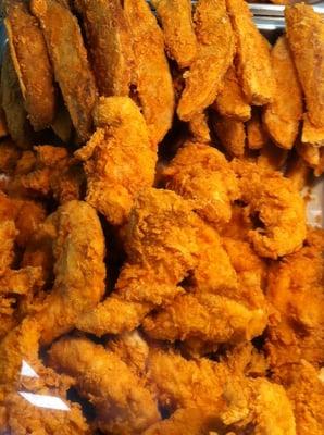 Hand breaded chicken tenders and potato logs.